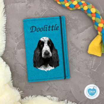 Preview: Designbeispiel der Impfpasshülle türkis für den Cocker Spaniel schwarz weiß